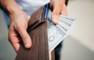 Man Holding Brown Leather Bi-fold Wallet With Money in It